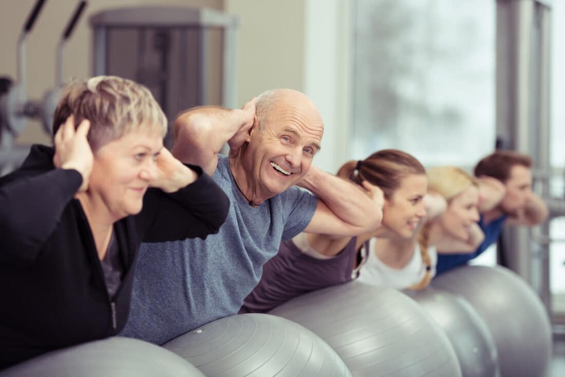 Elderly,Couple,Doing,Pilates,Class,At,The,Gym,With,A