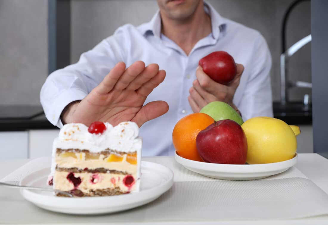 Man,Refuses,To,Eat,Unhealthy,Cake,And,Choose,Fruits,For