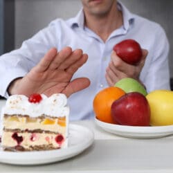 Man,Refuses,To,Eat,Unhealthy,Cake,And,Choose,Fruits,For